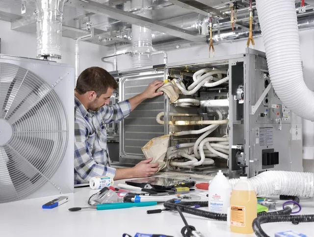 Wrentham Air Duct Cleaning specialist performing precision AC coil cleaning in Wrentham