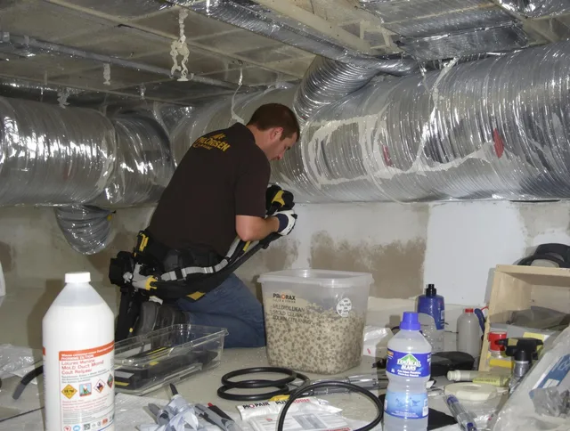 Wrentham Air Duct Cleaning specialist performing professional mold removal from air ducts in Wrentham