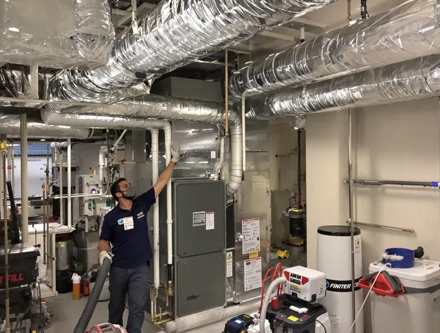 Wrentham Air Duct Cleaning specialist performing thorough furnace duct cleaning in a Wrentham residence