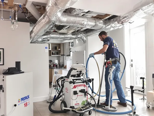 Wrentham Air Duct Cleaning technician performing advanced pure duct cleaning with specialized equipment in Wrentham