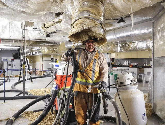 Professional vacuum insulation removal by Wrentham Air Duct Cleaning expert in Wrentham